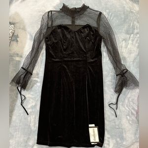 Black size 8 designer BURRYCO dress. Never worn with tags. Polyester.